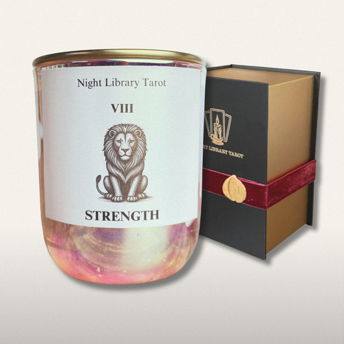 Candle with 'Strength' label and packaging on a light gray background
