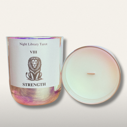 Candle with a label featuring a lion illustration and text on a light background