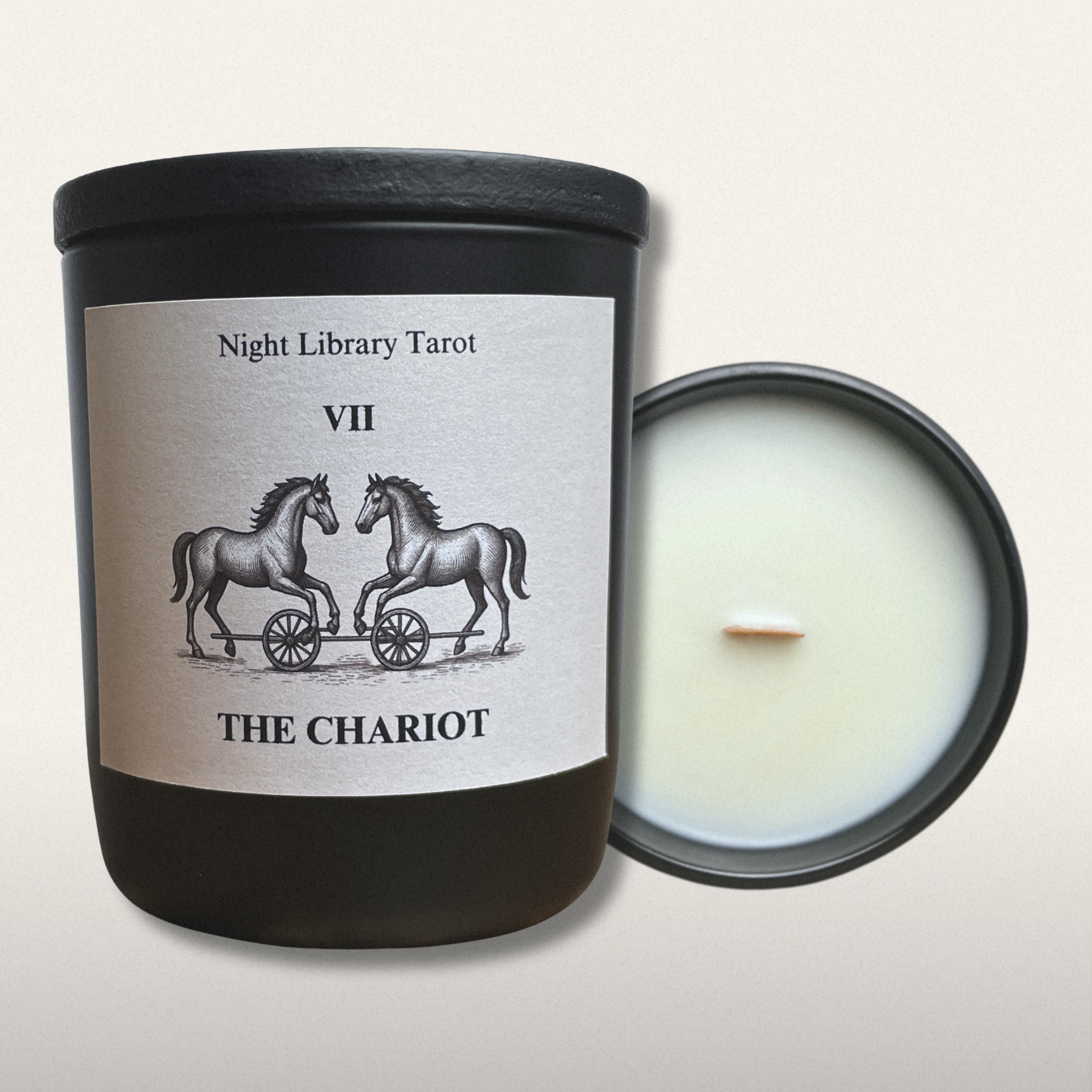 Candle with 'The Chariot' tarot card design on a white background
