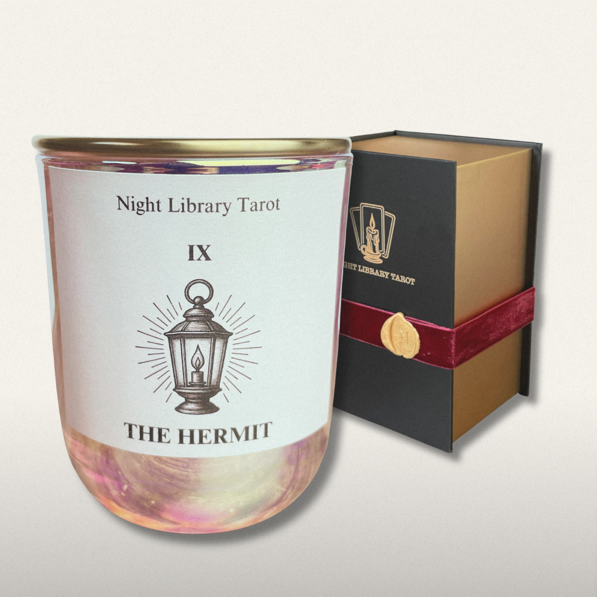 Candle labeled 'The Hermit' from Night Library Tarot with packaging on a light gray background