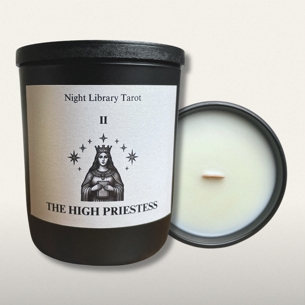 Candle in a black container with 'The High Priestess' tarot card design on the label.