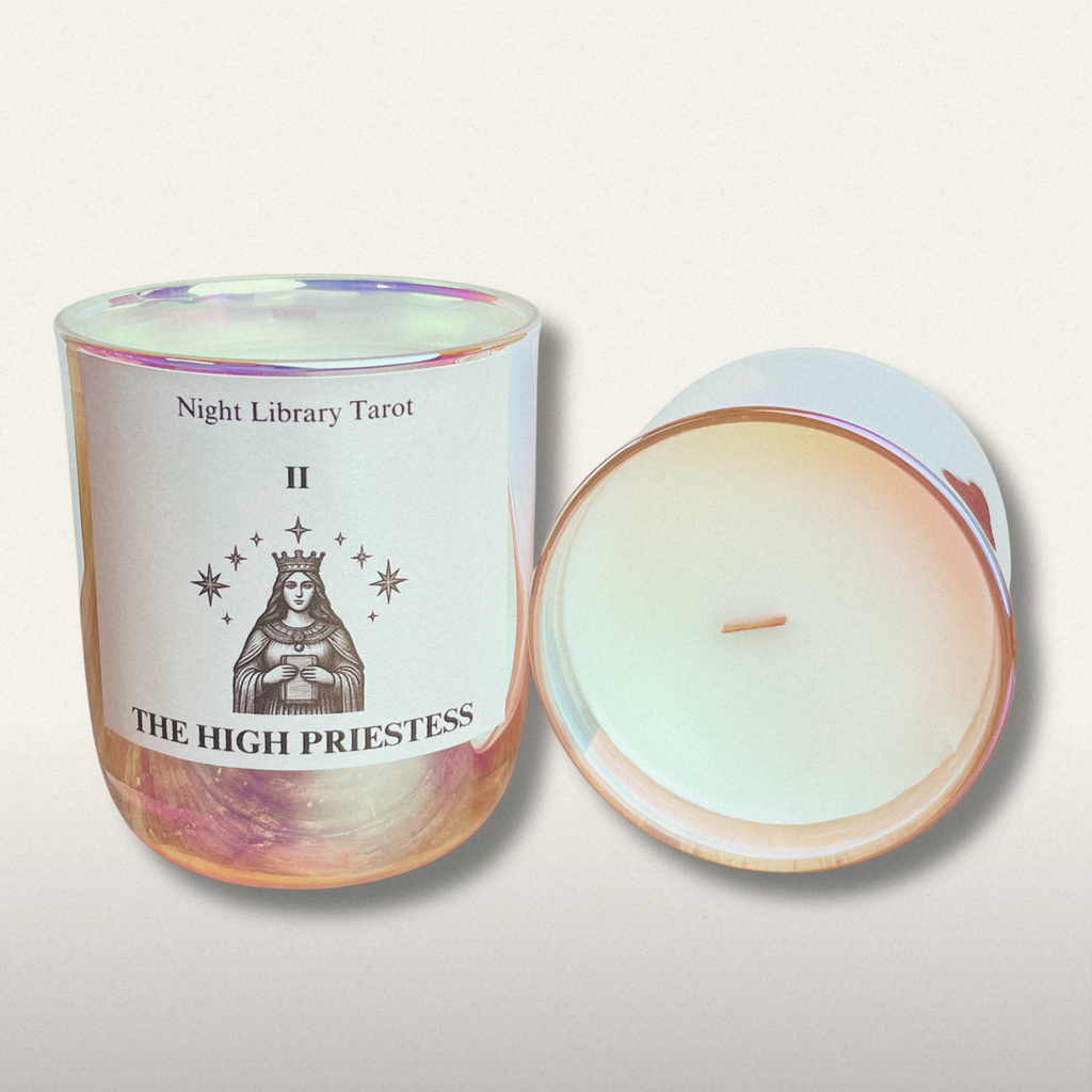 Candle with 'The High Priestess' design on a white background