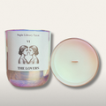 Candle with 'The Lovers' tarot card design on a white background