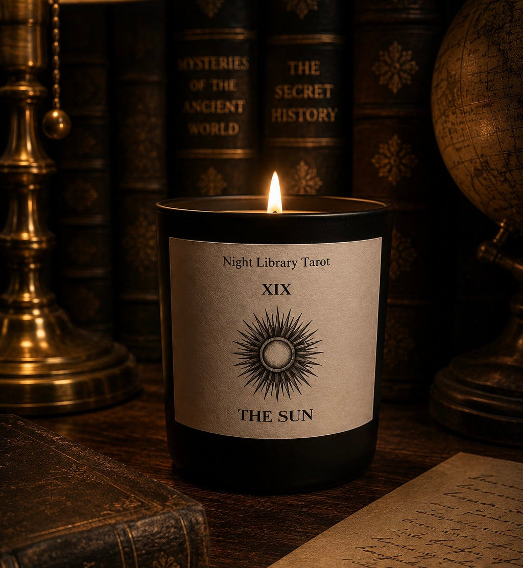 Candle labeled 'Night Library Tarot XIX The Sun' with books and a globe in the background. Luxury candle tarot inspired.